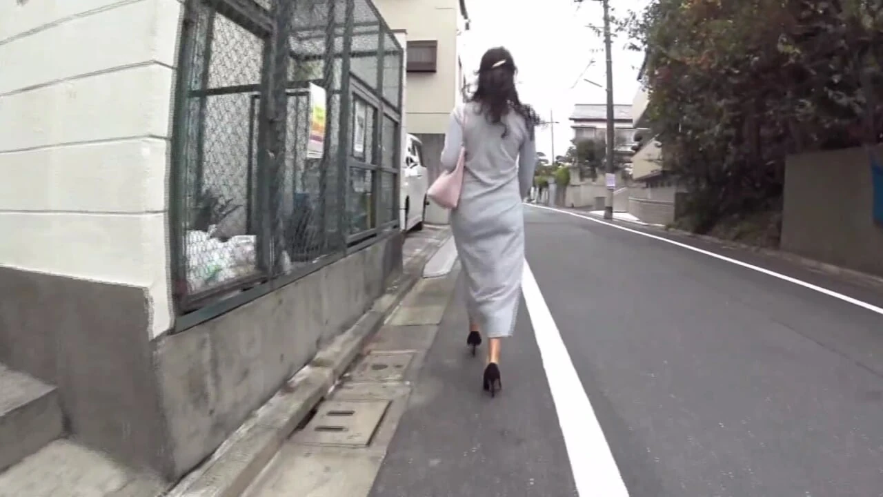 An Individual Follows A Scantily Clad Woman To A Secluded Area